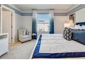 Bright bedroom with a comfy chair and large window at 3307 Private Oak Dr, Apopka, FL 32703