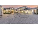 Luxury home with a paver driveway & modern architectural details at 1410 Shady Meadow Ln, Deland, FL 32724
