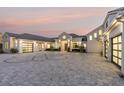 Modern home with a paver driveway & attached garage at 1410 Shady Meadow Ln, Deland, FL 32724