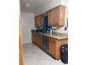 Spacious kitchen with wood cabinets, stainless steel appliances, and tile flooring at 2902 Calumet Dr, Orlando, FL 32810