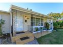 Inviting front porch with decorative metal railings and seating area at 4272 Kendrick Rd, Orlando, FL 32804