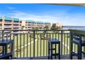 Balcony view of courtyard, landscaping, and ocean at 4501 S Atlantic Ave # 4090, New Smyrna Beach, FL 32169