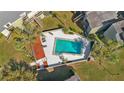 An aerial view of a community pool with surrounding landscaping at 126 Scottsdale Sq # 126, Winter Park, FL 32792