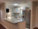 Modern kitchen with granite countertops and stainless steel appliances at 2205 12Th Nw St, Winter Haven, FL 33881