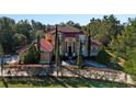 Luxury home with a red tile roof and lush green lawn at 502 W Lester Rd, Apopka, FL 32712