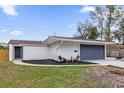 Updated home featuring a new paint job and fresh landscaping at 3553 Greenfield Ave, Orlando, FL 32808