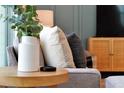 Close-up of living room decor, showcasing pillows and a side table at 866 Paradise Dr, Davenport, FL 33897
