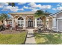 Attractive one-story home with columns and nicely landscaped yard at 1965 Fairway Loop, Kissimmee, FL 34746