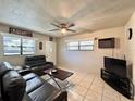 Living room featuring gray couches and ceiling fan at 412 Clemson Dr, Altamonte Springs, FL 32714