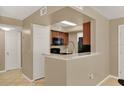 Kitchen features granite countertops and black appliances at 696 Youngstown Pkwy # 307, Altamonte Springs, FL 32714