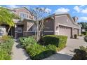 Attractive townhome with landscaping and walkway leading to the entrance at 850 Caneel Bay Ter, Winter Springs, FL 32708