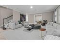 Spacious living room with contemporary furniture and large windows at 12023 Gold Creek Trl, Windermere, FL 34786
