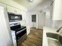 Kitchen with stainless steel appliances and white cabinets at 1234 Sago Palm Blvd # 1234, Kissimmee, FL 34741