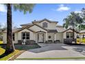 Two-story house with stone accents and a front porch at 168 Bethel Oaks Ln, Deltona, FL 32738