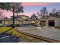 Two-story house with attached garage, featuring a palm tree in the front at 168 Bethel Oaks Ln, Deltona, FL 32738