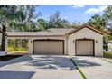 Two-car attached garage with light fixtures at 168 Bethel Oaks Ln, Deltona, FL 32738