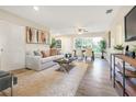 Bright and airy living room with hardwood floors and neutral decor at 2827 Euston Rd, Winter Park, FL 32789