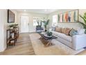 Open concept living room featuring hardwood floors and ample natural light at 2827 Euston Rd, Winter Park, FL 32789