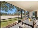 Relaxing screened-in porch overlooking a backyard at 3632 Serena Ln, Clermont, FL 34711