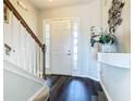 Bright entryway with hardwood floors and staircase at 611 Tuscan Hills Blvd, Davenport, FL 33897