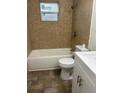 Clean bathroom featuring a bathtub and updated tile at 1730 N Orange St, Mount Dora, FL 32757