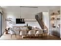 Bright dining area with a large wooden table and modern chandelier at 227 Page St, Orlando, FL 32806