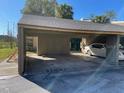 Covered carport with parking space for one vehicle at 5466 Pine Creek Dr # 2002, Orlando, FL 32811
