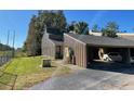Condo exterior showcasing a unique roofline and landscaping at 5466 Pine Creek Dr # 2002, Orlando, FL 32811