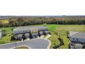 Modern townhomes nestled near a golf course and lush greenery at 856 Driving Range Ct, Reunion, FL 34747
