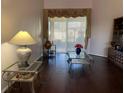 Bright living room featuring hardwood floors and sliding glass doors at 9111 Woodbridge Oak Ter, Orlando, FL 32825