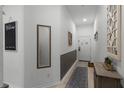 Bright entryway with mirror and small table at 411 Lucaya Loop # 411, Davenport, FL 33897