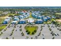 Aerial view of a community with modern buildings and parking at 7740 Sandy Ridge Dr # 9-236, Kissimmee, FL 34747