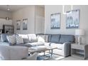 Bright living area featuring a sectional sofa and large windows at 7740 Sandy Ridge Dr # 9-236, Kissimmee, FL 34747