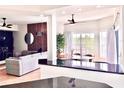 Open concept dining area with table and chairs near living room at 8601 Worldquest Blvd # 3307, Orlando, FL 32821