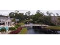 Wooden bridge over a waterway in a community setting at 940 Village Trl # 9-303, Port Orange, FL 32127