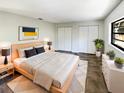 Bright bedroom with large bed, modern nightstands, and ample closet space at 4026 Tenita Dr, Winter Park, FL 32792