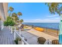 Backyard oasis with water views, patio furniture, and a kayak at 3420 Lake Harney Cir, Geneva, FL 32732