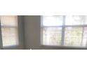 Bright bedroom with window blinds and neutral walls at 413 Summit Ridge Pl # 305, Longwood, FL 32779