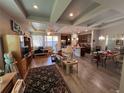 Open floor plan living room and kitchen with hardwood floors at 556 Lake Wildmere Cv, Longwood, FL 32750