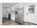 Modern kitchen featuring stainless steel appliances and teal dishwasher at 603 Conrad Dr, New Smyrna Beach, FL 32168