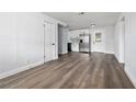 Bright living room featuring luxury vinyl plank flooring and an open floor plan at 603 Conrad Dr, New Smyrna Beach, FL 32168