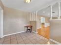 Bright entryway with tiled floor, a small table, and a view to the hardwood living area at 708 Balmoral Rd, Winter Park, FL 32789