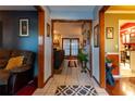 Inviting entryway with wood floors and views into the living areas at 1094 Red Dandy Dr, Orlando, FL 32818