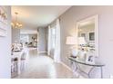 View of the entryway, showcasing the tile floors and access to the dining room and living areas at 1610 Bull Hill Rd, Kissimmee, FL 34744