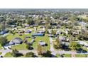 Aerial view of residential neighborhood, showcasing various homes and landscaping at 710 Spruce St, New Smyrna Beach, FL 32168