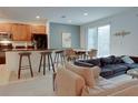 Kitchen with island, stainless steel appliances, and breakfast bar at 4565 Cabello Loop, Kissimmee, FL 34746