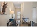 Dining area with dark wood table and modern chairs at 820 Pebble Beach Dr, Davenport, FL 33896