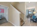 Stairwell view shows a tiled floor and access to upper level at 820 Pebble Beach Dr, Davenport, FL 33896