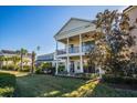 Two-story home with a large backyard, a patio, and a pool at 7513 Excitement Dr, Reunion, FL 34747