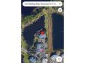 Aerial view showing the condo location near a lake at 210 Watling Way # 24-210, Davenport, FL 33897